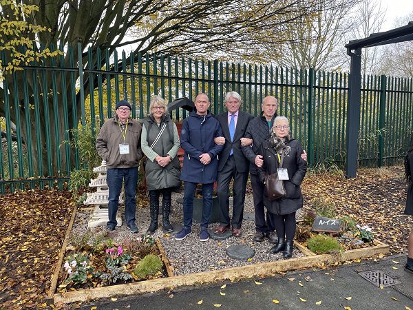 Sutton Coldfield MP Andrew Mitchell with Louise' family at the Louis Watkiss memorial garden.