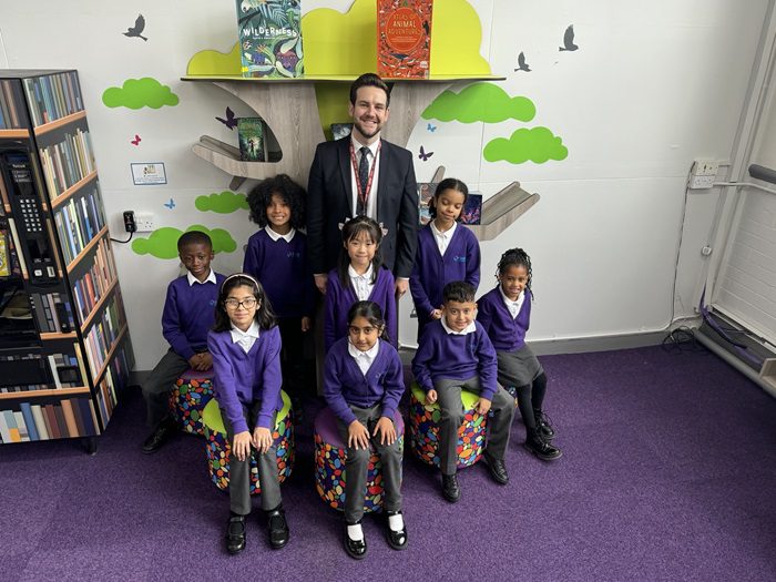 Danny Jones, with students from Slade Primary School.