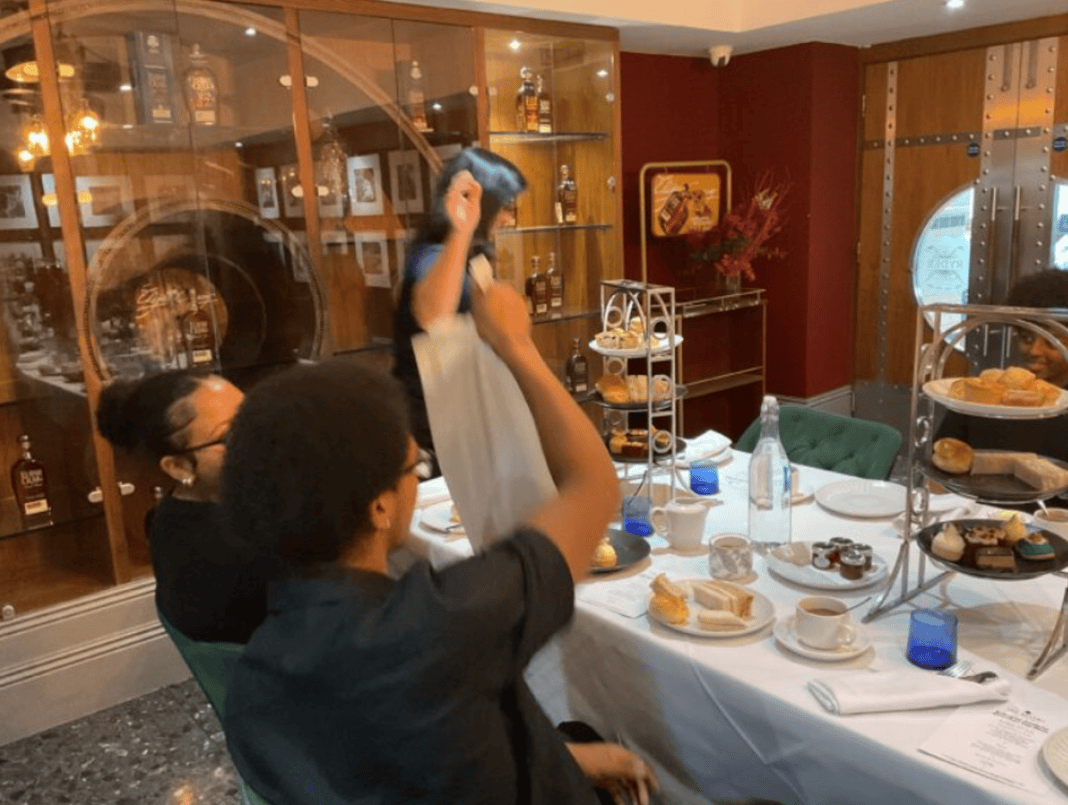 Erdington students serve afternoon tea to impressed teachers and parents at the Belfry.
